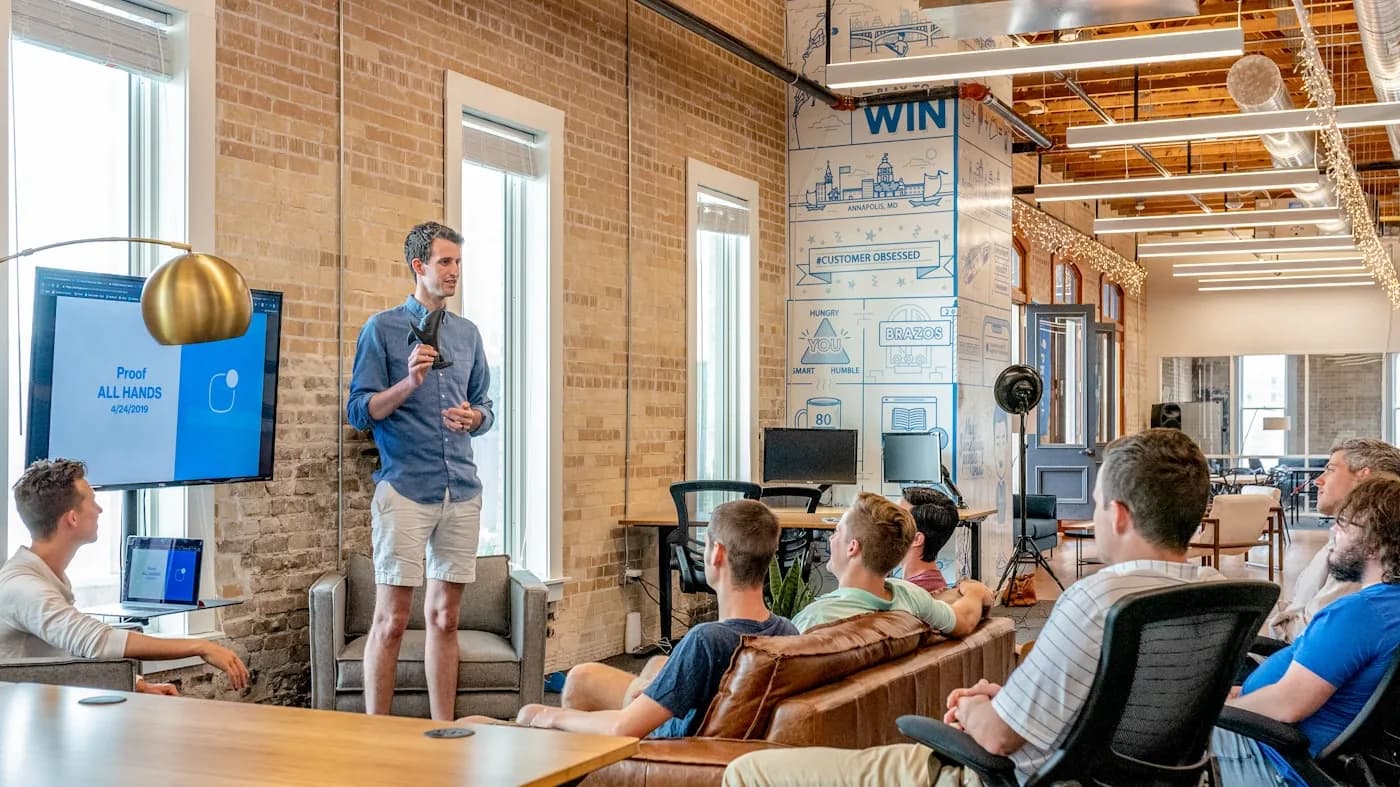 Go-to-market team around a laptop prioritizing inbound leads, SLAs, and follow-up sequences